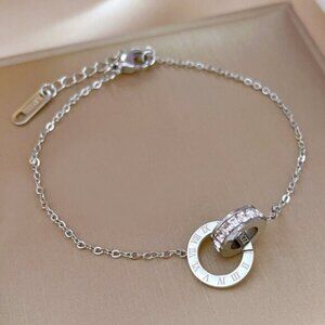 Stainless Steel Interlocking Rings , Simulated Diamond Roman Numeral Bracelet